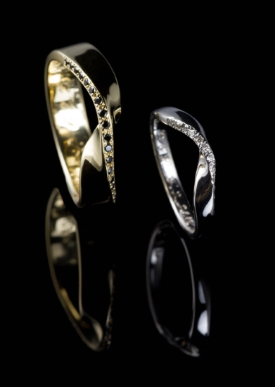 Gold wedding bands, black and white diamonds